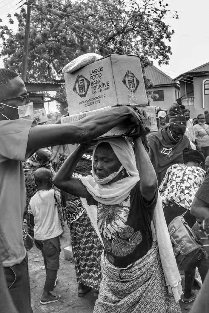 our-services-1 Volunteers help distribute food boxes during a charity event in Lagos.